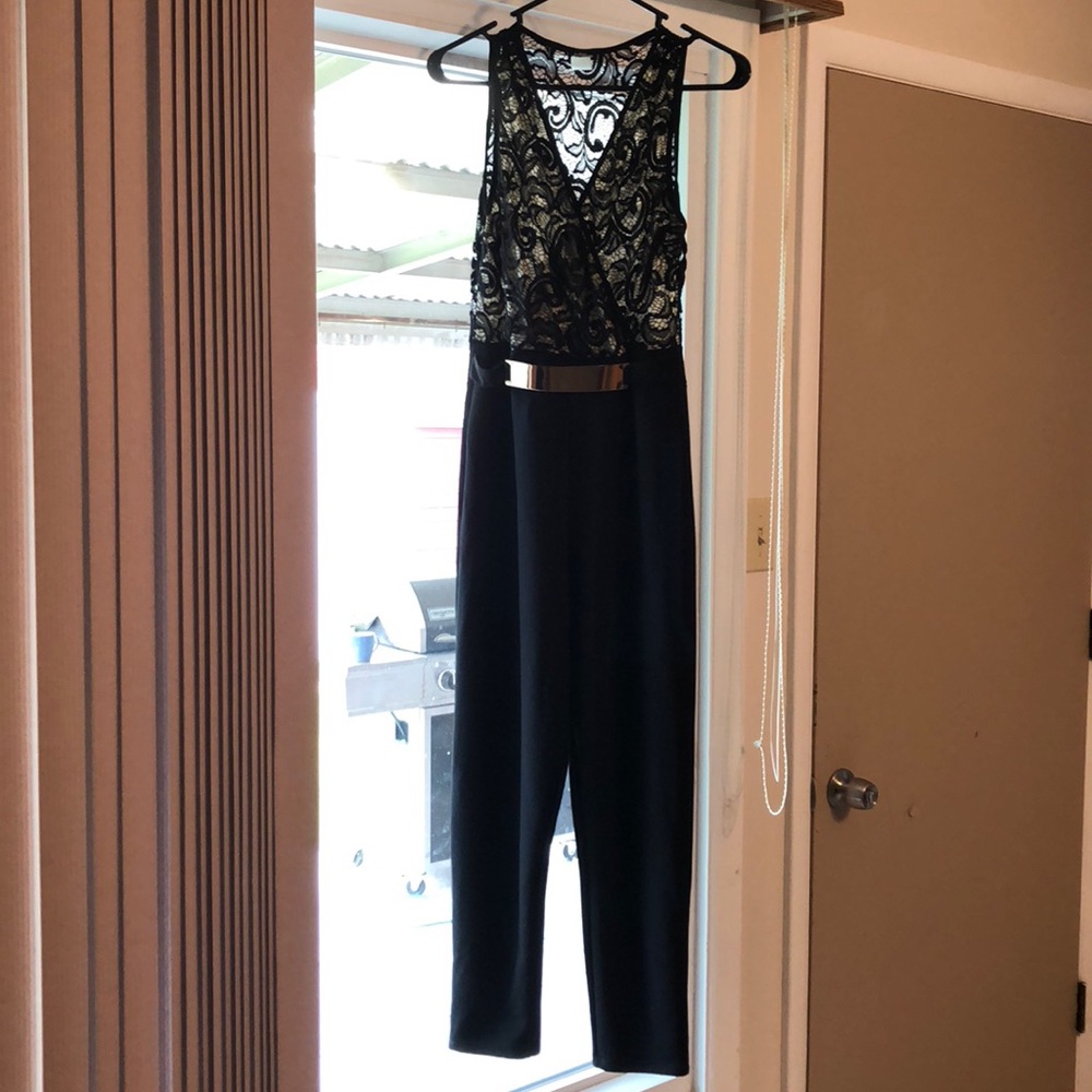 Beautiful black jumpsuit with see through back